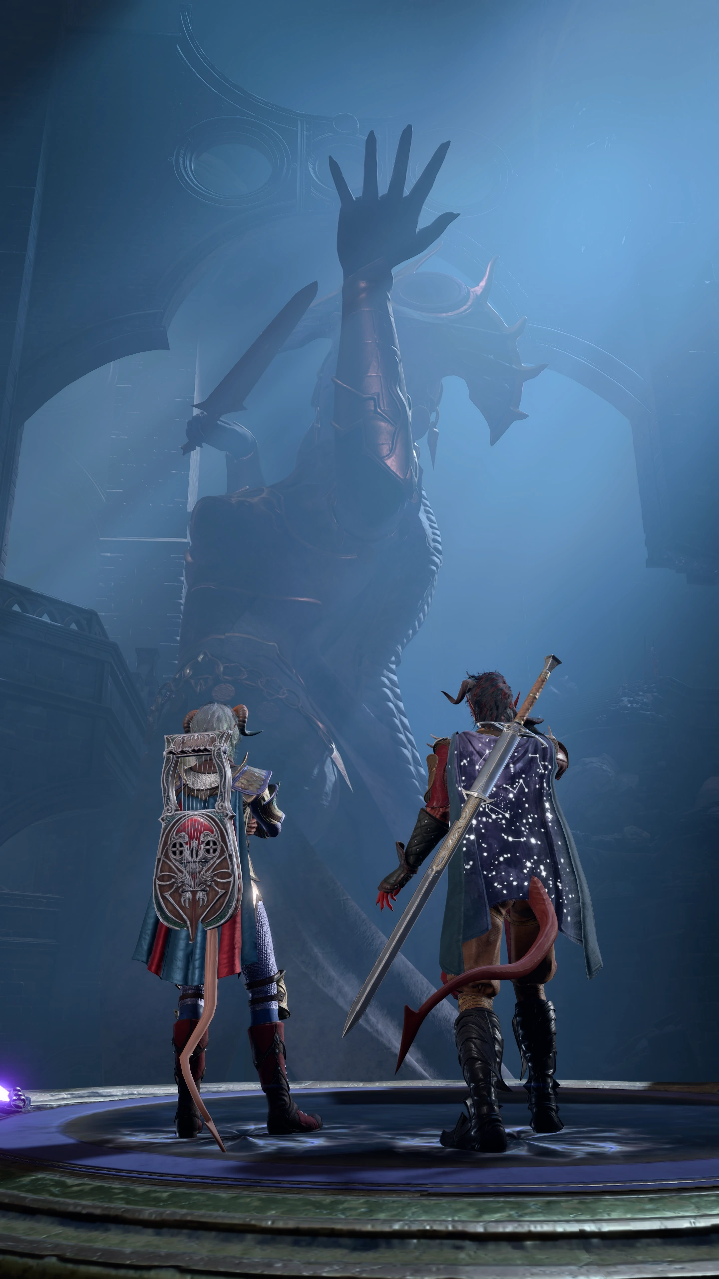 Ramie and Karlach in front of a huge statue.