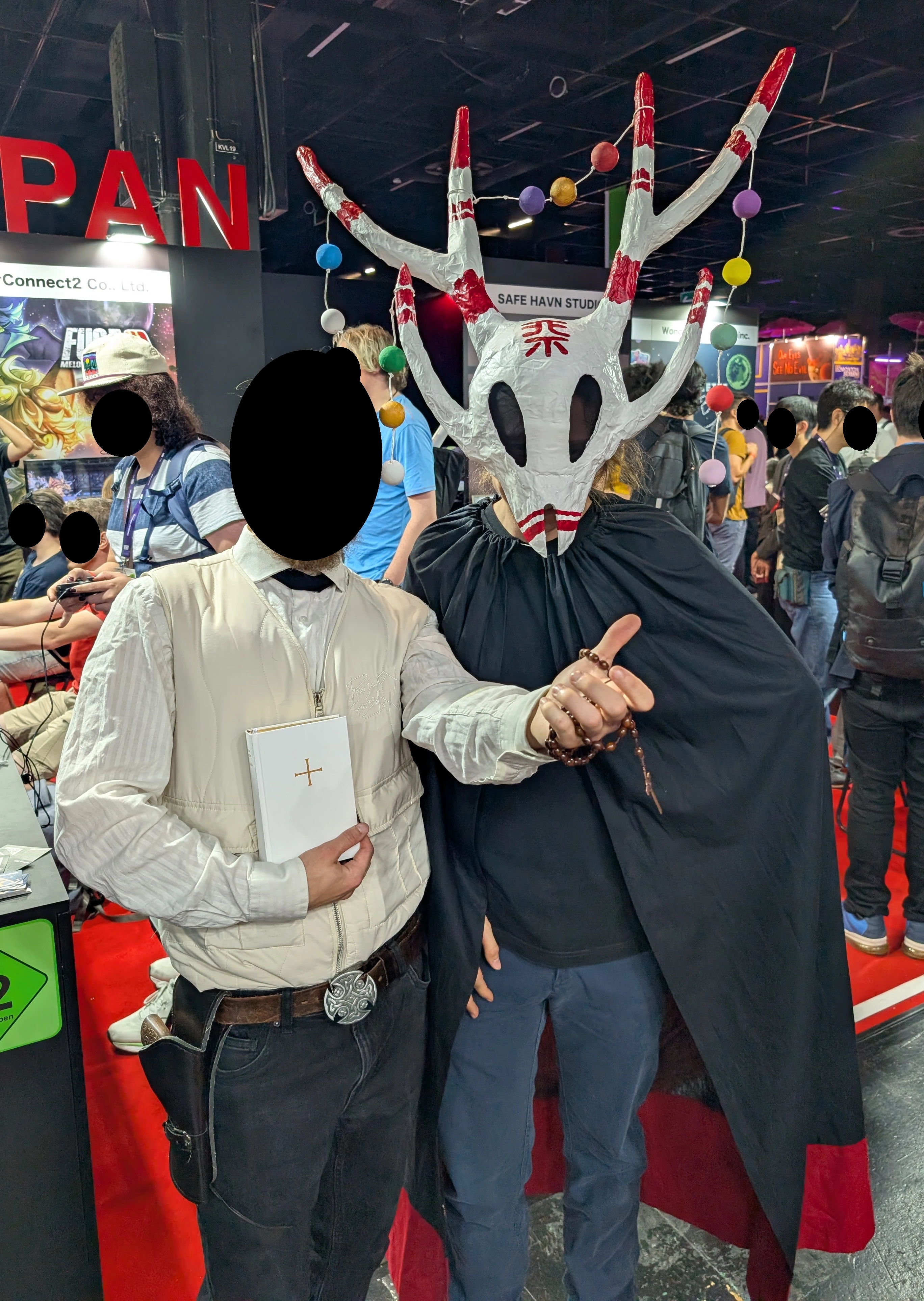 A selfie of myself wearing the outfit, with someone cosplaying the Pope from Far Cry next to me.
